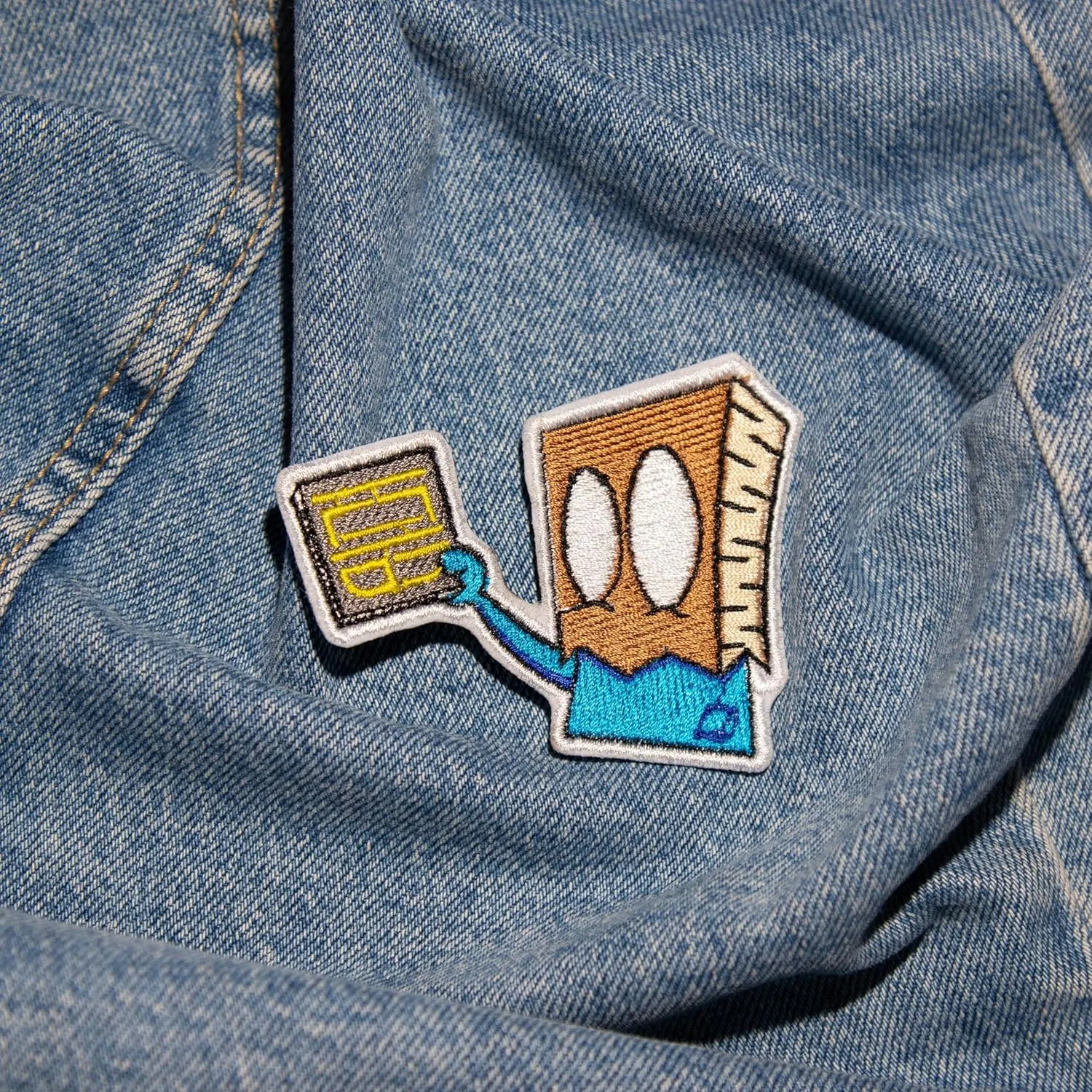 Premium Quality Bag of Expressions: Carry a Playful Face Everywhere with Our Face-in-a-Bag Patch